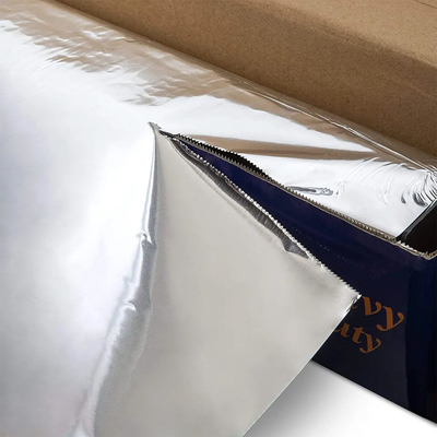 Petit pain résistant supplémentaire argenté de papier d'aluminium de ménage avec le coupeur de dent de scie de bande